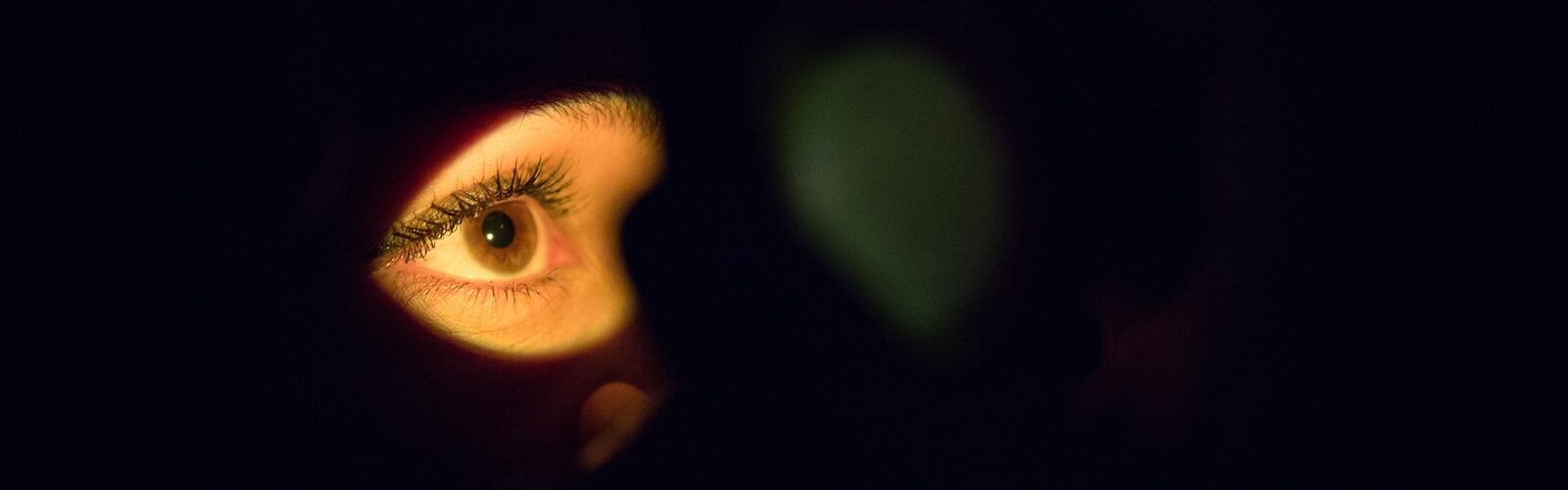 womans face with green eyes