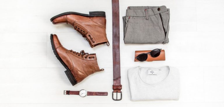pair of brown leather boots beside bet