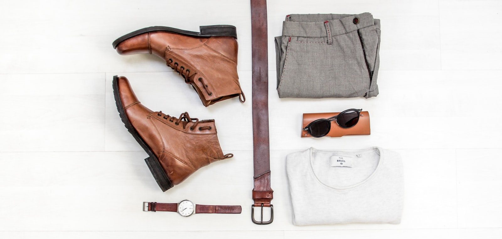 pair of brown leather boots beside bet