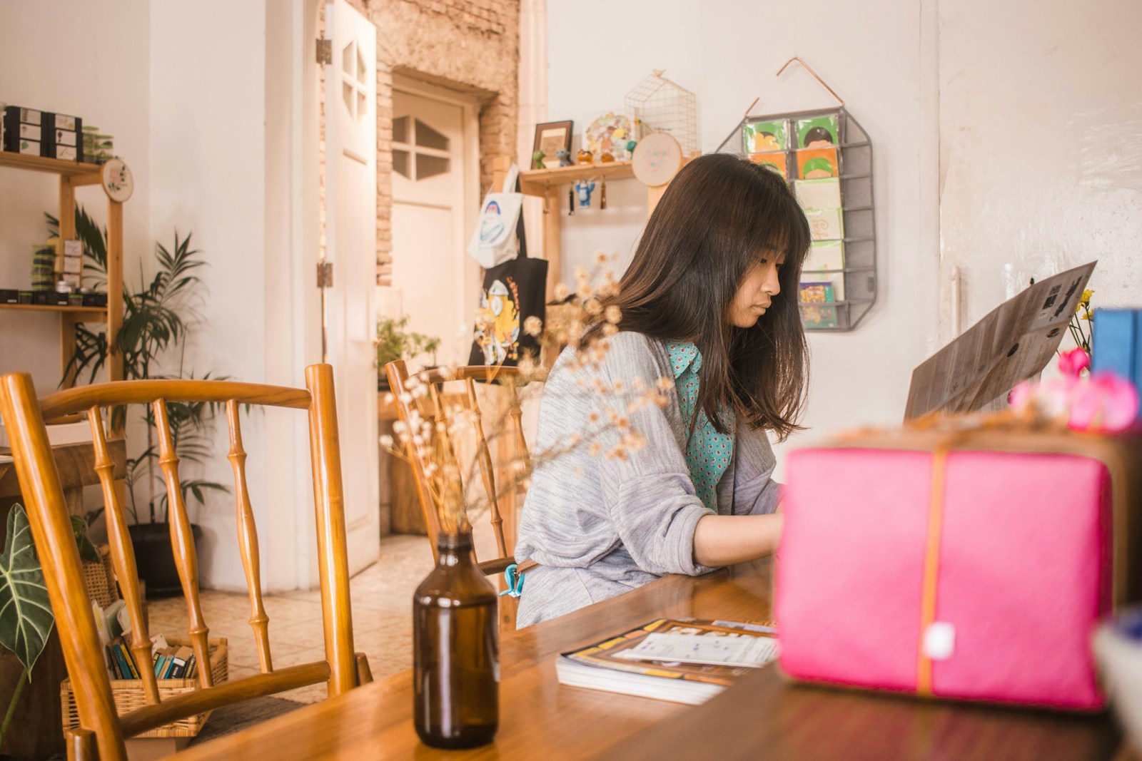 woman in front of brown dining table